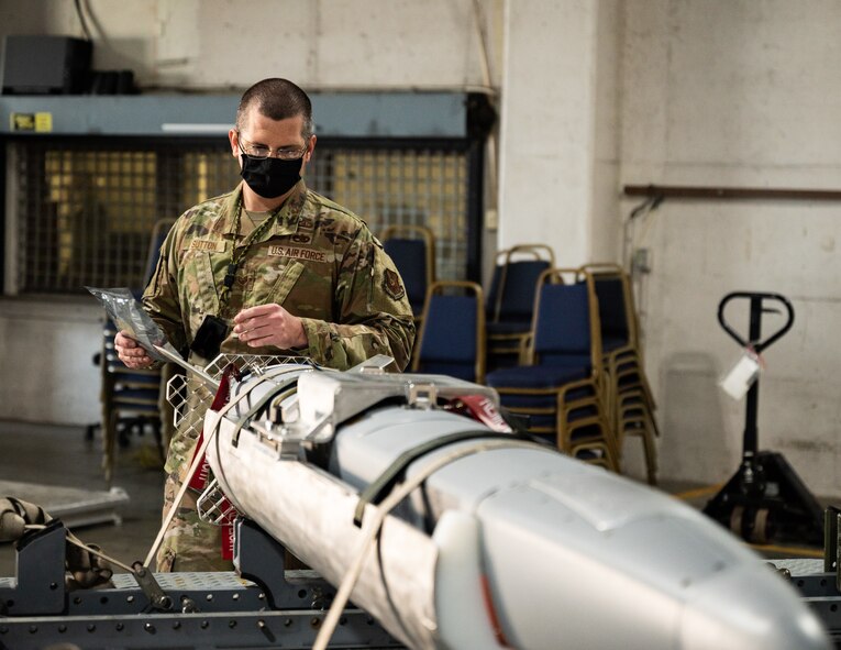 Tech. Sgt. Derek Sutton, 2nd Munitions Squadron conventional maintenance crew chief, inspects an ADM-160 Miniature Air-Launched Decoy missile at Barksdale Air Force Base, Louisiana, Aug. 24, 2021.