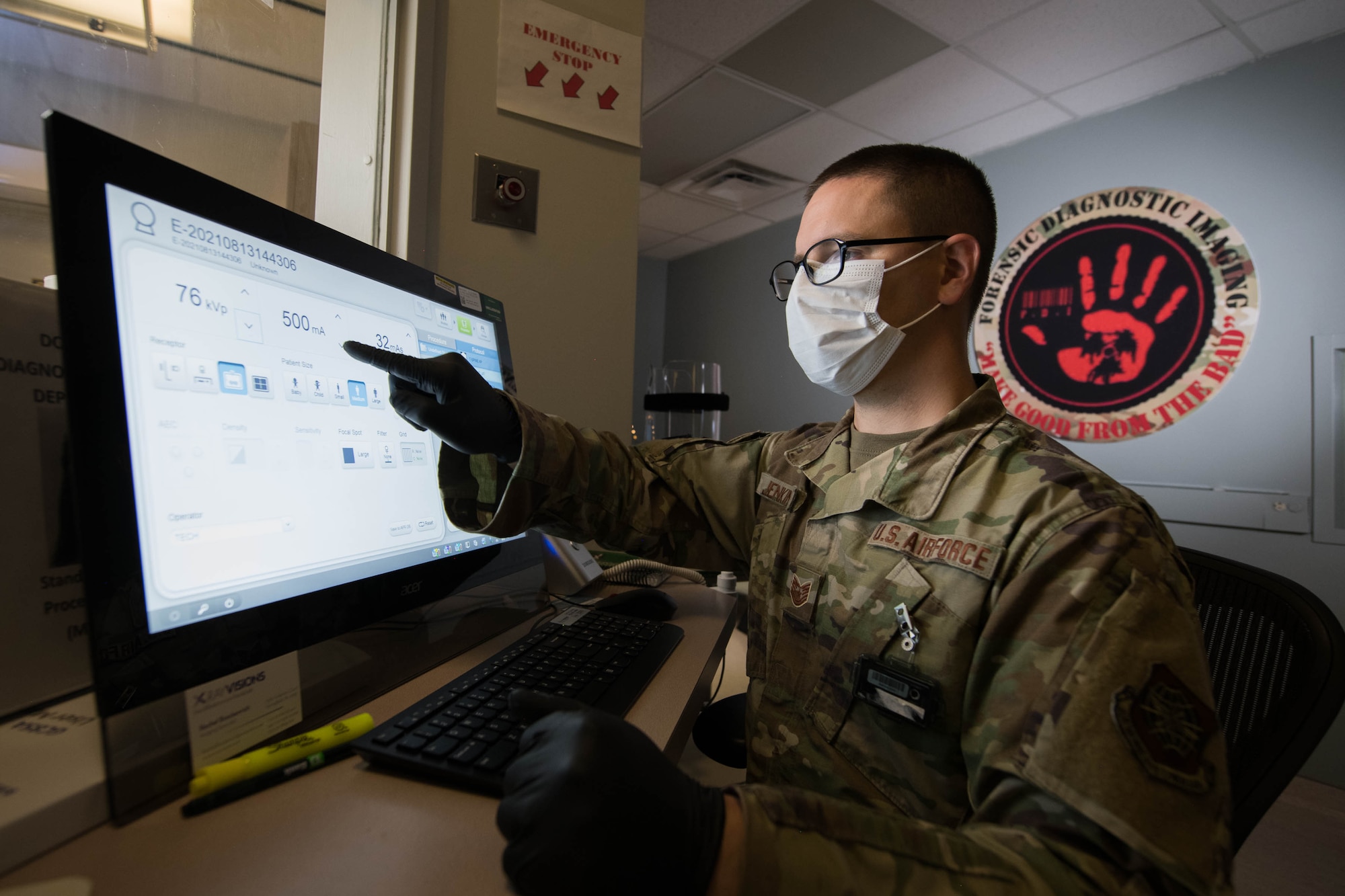 Tech. Sgt. Timothy Jenkins, 436th Medical Support Squadron Diagnostic Imaging section chief, prepares to take an X-ray on Dover Air Force Base, Delaware, Aug. 13, 2021. In assisting the Armed Forces Medical Examiner System with autopsies, the section has the capability to complete a full body X-ray in less than 16 seconds. They can also provide full-body computed tomography (CT) scans, fluoroscopy and 3D imaging. (U.S. Air Force photo by Mauricio Campino)