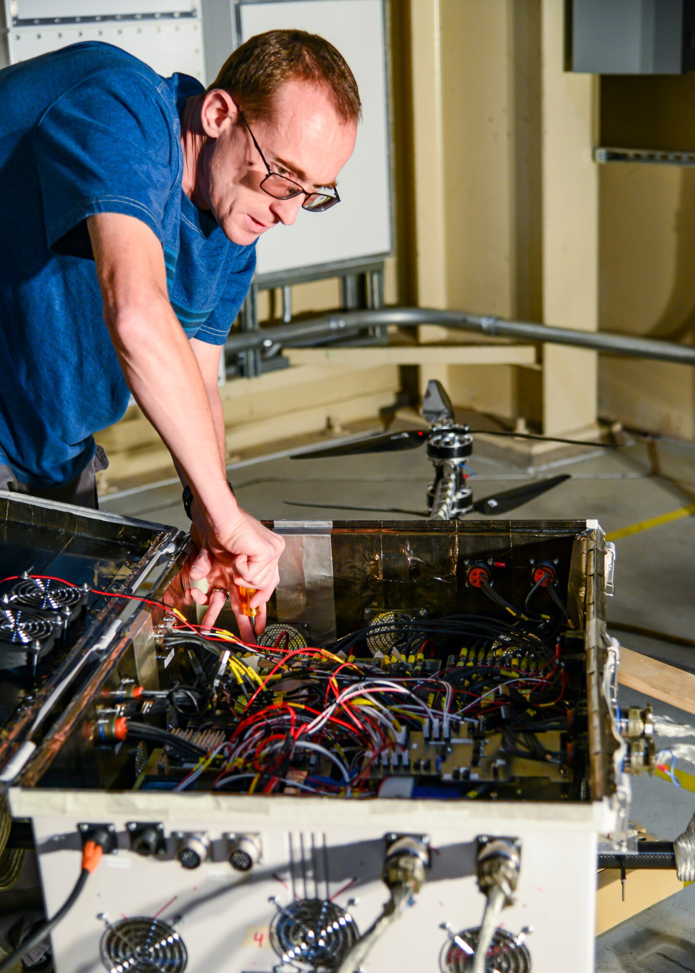 Aleksandr Yarovinskiy works on the body of his unmanned aircraft system in a work area just outside the main chamber of the Benefield Anechoic Facility. Yarovinskiy has secured funding from SparkED, the 412th Test Wing’s innovation team, to design, build, test and deliver a drone that has the potential to expand and enhance the BAF’s data-capture capabilities. (Air Force photo by Gary Hatch)