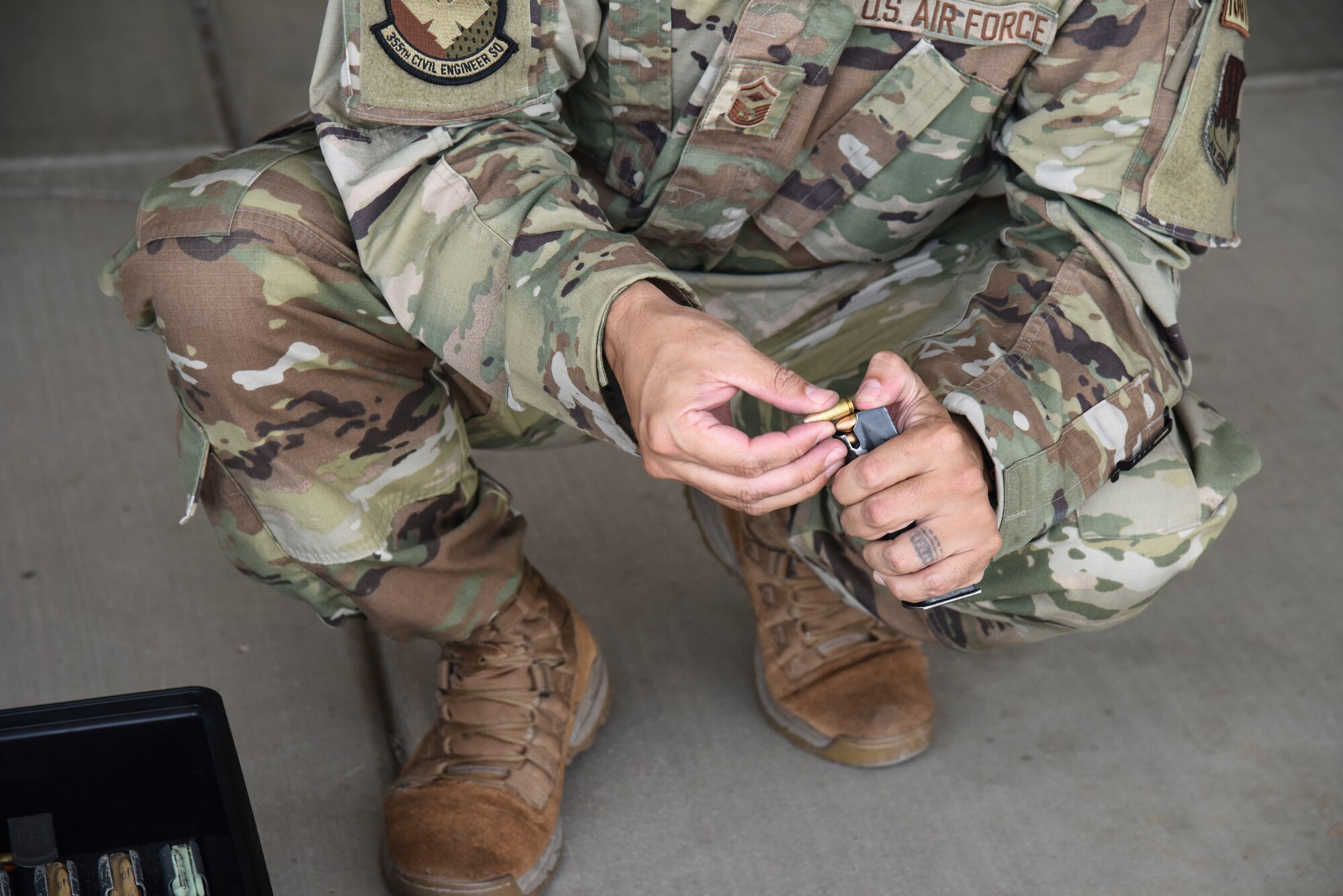 Pictured above is an Airman loading ammunition into a magazine.