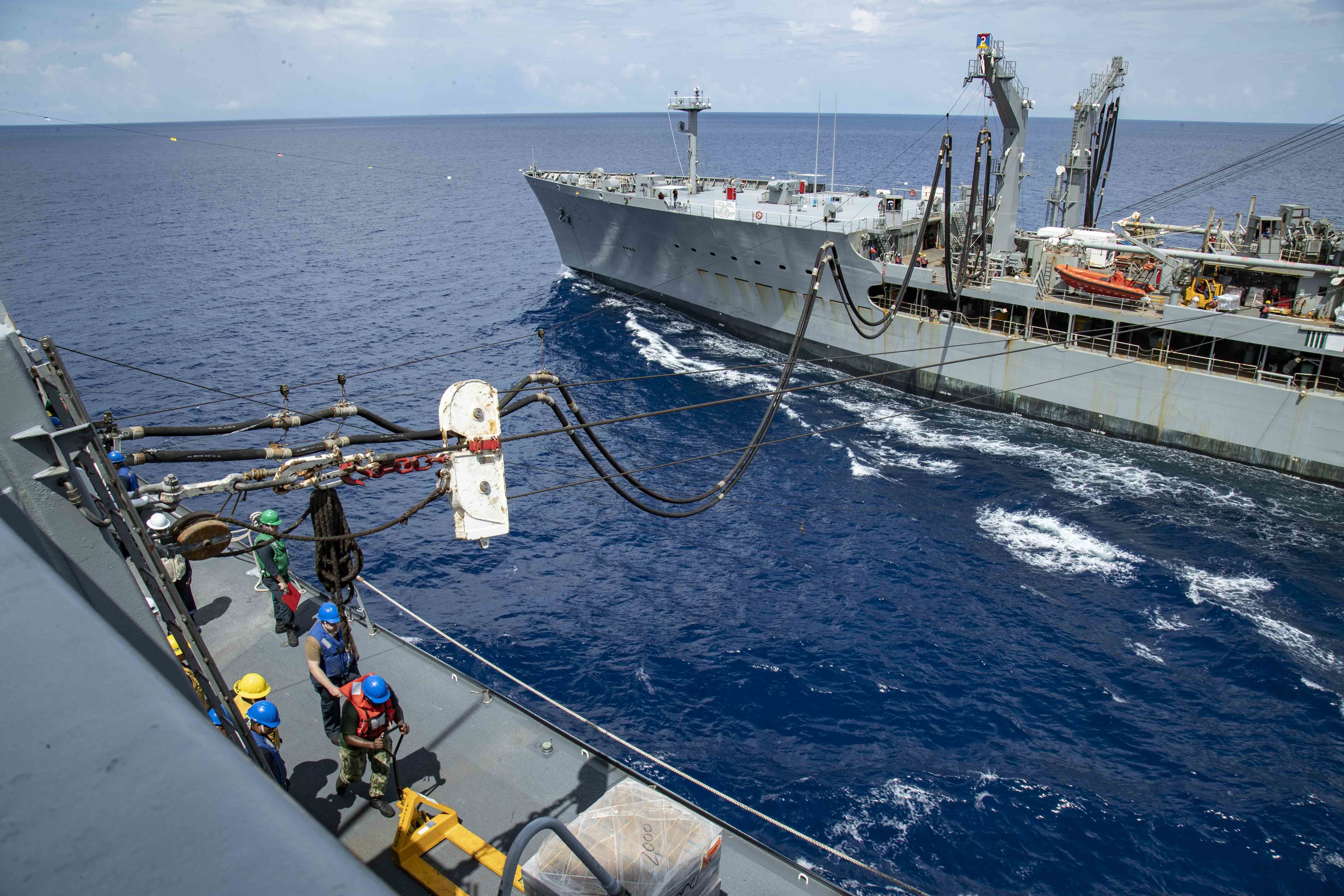 USNS Tippecanoe (T-AO 199) steams alongside the amphibious transport dock ship USS Green Bay (LPD 20) during a replenishment-at-sea.