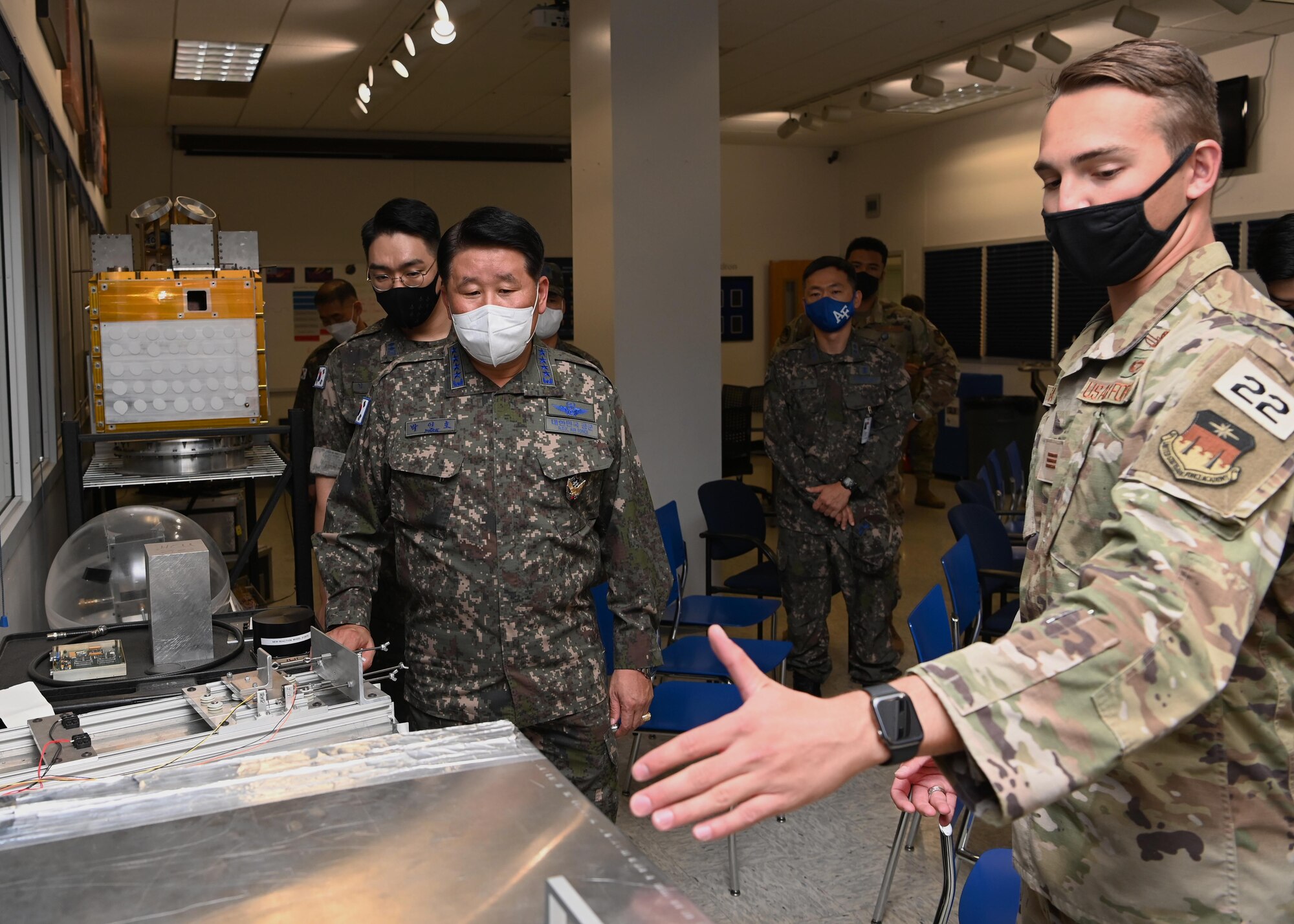 Cadet 1st Class Andrew LaGassa briefs Republic of Korea Air Force Gen. Inho Park, ROKAF Chief of Staff, during a tour of the U.S. Air Force Academy’s Astronautics Laboratory