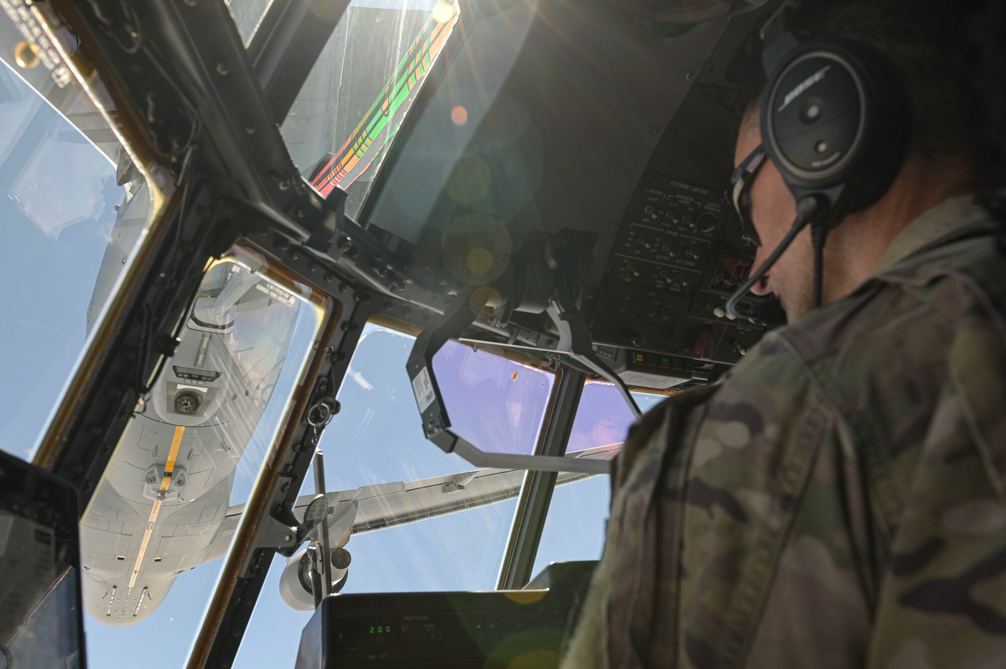 U.S. Air Force Lt. Col. Phillip Varilek, 71st Rescue Squadron HC-130J Combat King II pilot, positions an HC-130J below a KC-46A Pegasus assigned to the 916th Air Refueling Wing, Seymour Johnson Air Force Base, North Carolina, during an air-to-air refuel near Moody Air Force Base, Georgia, Aug. 24, 2021. The 71st RQS is the first operational unit to be refueled by the KC-46A Pegasus. (U.S. Air Force photo by Senior Airman Rebeckah Medeiros)