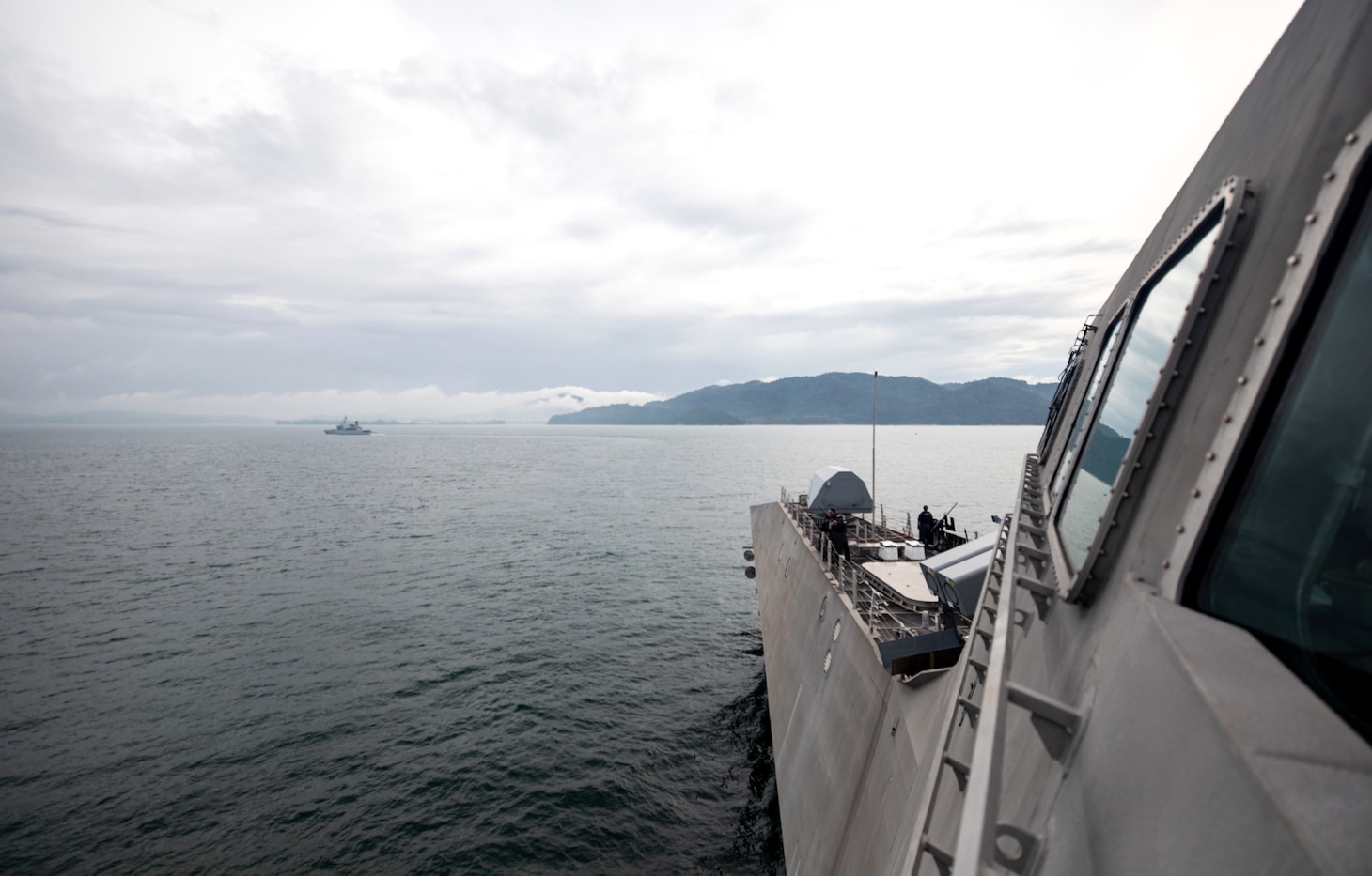 211129-N-LI768-1026 LUMUT, Malaysia (Nov. 29, 2021) - The Independence-variant littoral combat ship USS Tulsa (LCS 16) arrives at Lumut, Malaysia, following Maritime Training Activity (MTA) Malaysia 2021. MTA Malaysia 2021 is a continuation of 27 years of maritime engagements between the U.S. Navy and Royal Malaysian Navy serving to enhance mutual capabilities in ensuring maritime security and stability. Tulsa, part of Destroyer Squadron (DESRON) 7, is on a rotational deployment, operating in the U.S. 7th Fleet area of operations to enhance interoperability with partners and serve as a ready-response force in support of a free and open Indo-Pacific region. (U.S. Navy photo by Mass Communication Specialist 1st Class Devin M. Langer)