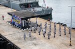 211129-N-LI768-1144 LUMUT, Malaysia (Nov. 29, 2021) – Royal Malaysian Navy Sailors play music as the U.S. Navy Independence-variant littoral combat ship USS Tulsa (LCS 16) arrives at Lumut, Malaysia, following Maritime Training Activity (MTA) Malaysia 2021. MTA Malaysia 2021 is a continuation of 27 years of maritime engagements between the U.S. Navy and Royal Malaysian Navy serving to enhance mutual capabilities in ensuring maritime security and stability. Tulsa, part of Destroyer Squadron (DESRON) 7, is on a rotational deployment, operating in the U.S. 7th Fleet area of operations to enhance interoperability with partners and serve as a ready-response force in support of a free and open Indo-Pacific region. (U.S. Navy photo by Mass Communication Specialist 1st Class Devin M. Langer)
