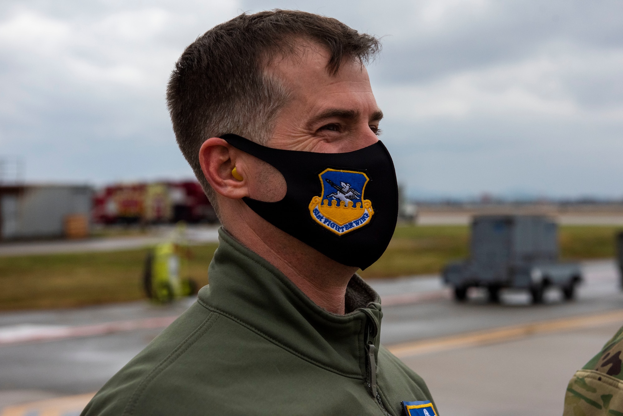 Col. Joshua Wood, 51st Fighter Wing commander, awaits the arrival of Gen. Mark Milley, Chairman of the Joint Chiefs of Staff