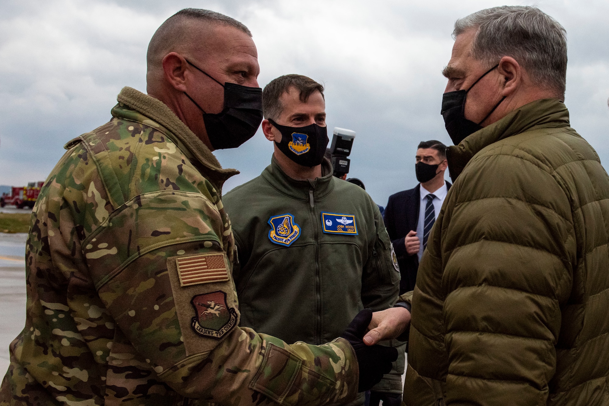 Gen. Mark A. Milley, Chairman of the Joint Chiefs of Staff, receives a greeting from Col. Joshua Wood, 51st Fighter Wing commander, and Chief Master Sgt. Justin Apticar, 51st Fighter Wing command chief
