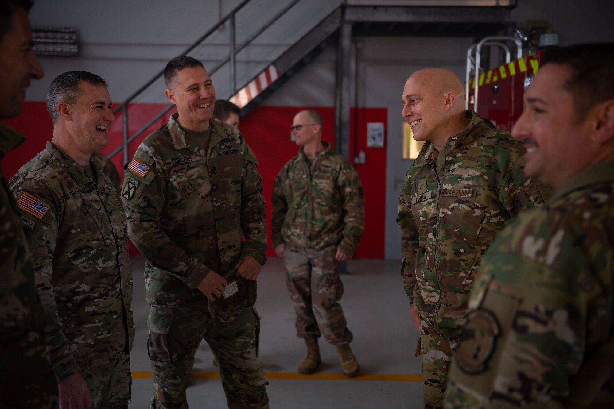 U.S. Air Force Brig. Gen. Josh Olson, second from right, 86th Airlift Wing commander, meets with U.S. Army Col. James Yastrzemski, second from left, U.S. Army Garrison Benelux commander, at Chievres Air Base, Belgium, Nov. 16, 2021. Olson visited Chievres for a 424 Air Base Squadron immersion tour. The Army Garrison Benelux mission is to integrate and deliver quality base operations support to soldiers, civilians, families and retirees. (U.S. Air Force photo by Airman Jared Lovett)