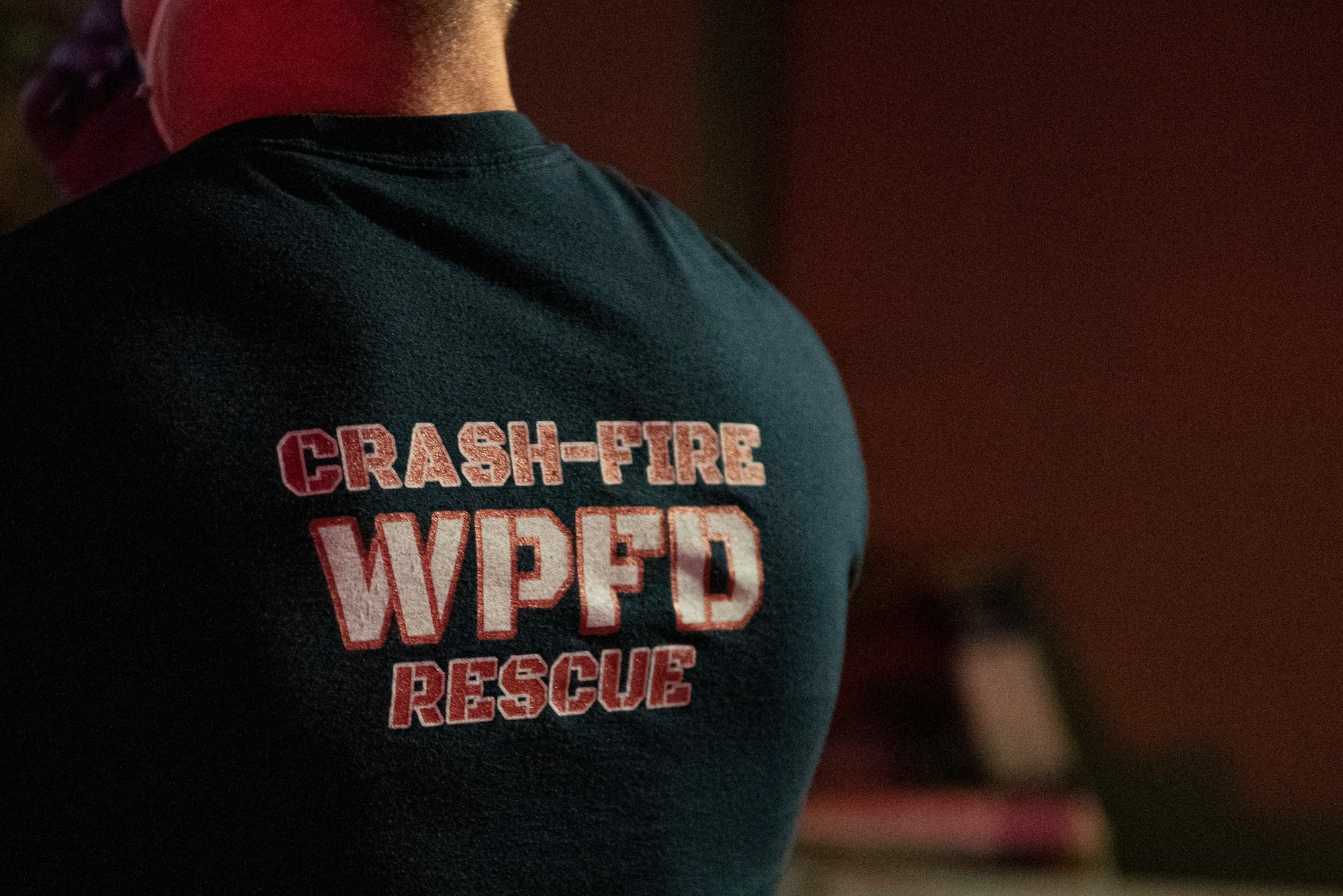 A firefighter responds to a call for help, June 23, 2021 at Wright-Patterson Air Force Base, Ohio.  The base has three stations strategically located to ensure a response time of 5 minutes or less when the call comes in. (U.S. Air Force photo by Wesley Farnsworth)