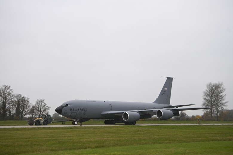 U.S. Airmen assigned to the 100th Air Refueling Wing move a Block 45 variant of a KC-135 Stratotanker aircraft along the flightline at Royal Air Force Mildenhall, England, Nov. 24, 2021. The Block 45 variant of KC-135 is equipped with advanced autopilot and glass display instrument features. (U.S. Air Force photo by Senior Airman Joseph Barron)