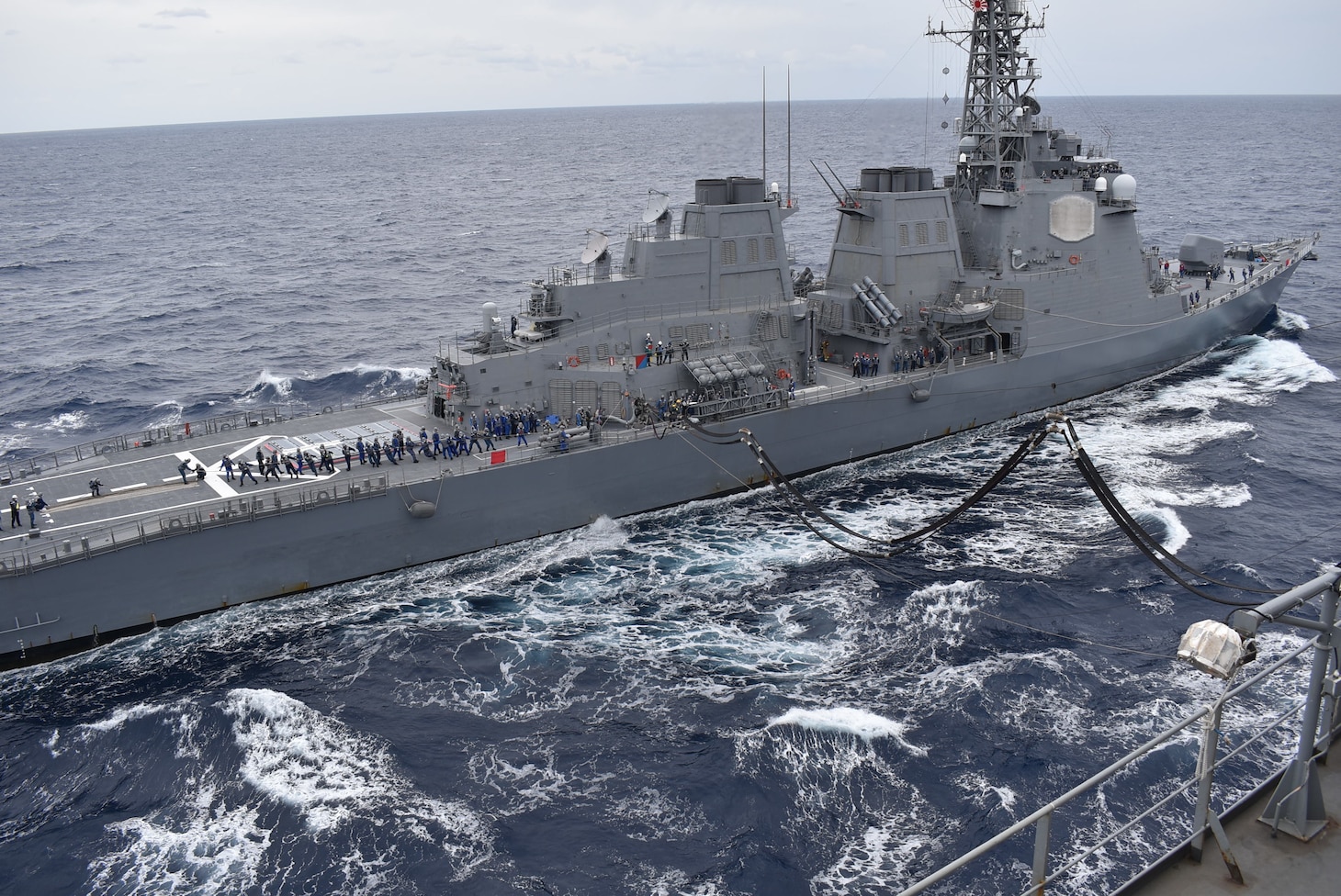 PHILIPPINE SEA (Nov. 27, 2021) -- Henry J. Kaiser-class replenishment oiler USNS Big Horn (T-AO198) conducts underway replenishments in the Philippine Sea with partners and allies, including Anzac-class frigate HMAS Warramunga (FFH 152) of the Royal Australian Navy, as part of Annual Exercise, Nov. 21-30.  Naval forces from Australia, Canada, Germany, Japan and the United States took part in the multilateral, multinational exercise, led by the Japan Maritime Self-Defense Force.  The exercise helps strengthen enduring relationships while sharpening naval proficiencies. (Photo by Juahn Gaskins)