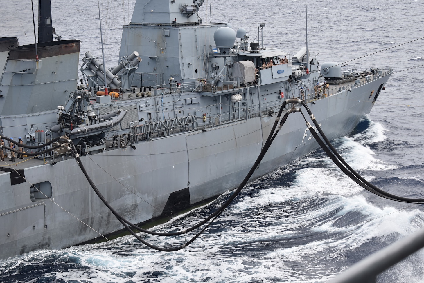 PHILIPPINE SEA (Nov. 27, 2021) -- Henry J. Kaiser-class replenishment oiler USNS Big Horn (T-AO198) conducts underway replenishments in the Philippine Sea with partners and allies, including FGS Bayern (F217), Germany’s Brandenburg-class frigate, as part of Annual Exercise, Nov. 21-30.  Naval forces from Australia, Canada, Germany, Japan and the United States took part in the multilateral, multinational exercise, led by the Japan Maritime Self-Defense Force.  The exercise helps strengthen enduring relationships while sharpening naval proficiencies. (Photo by Juahn Gaskins)