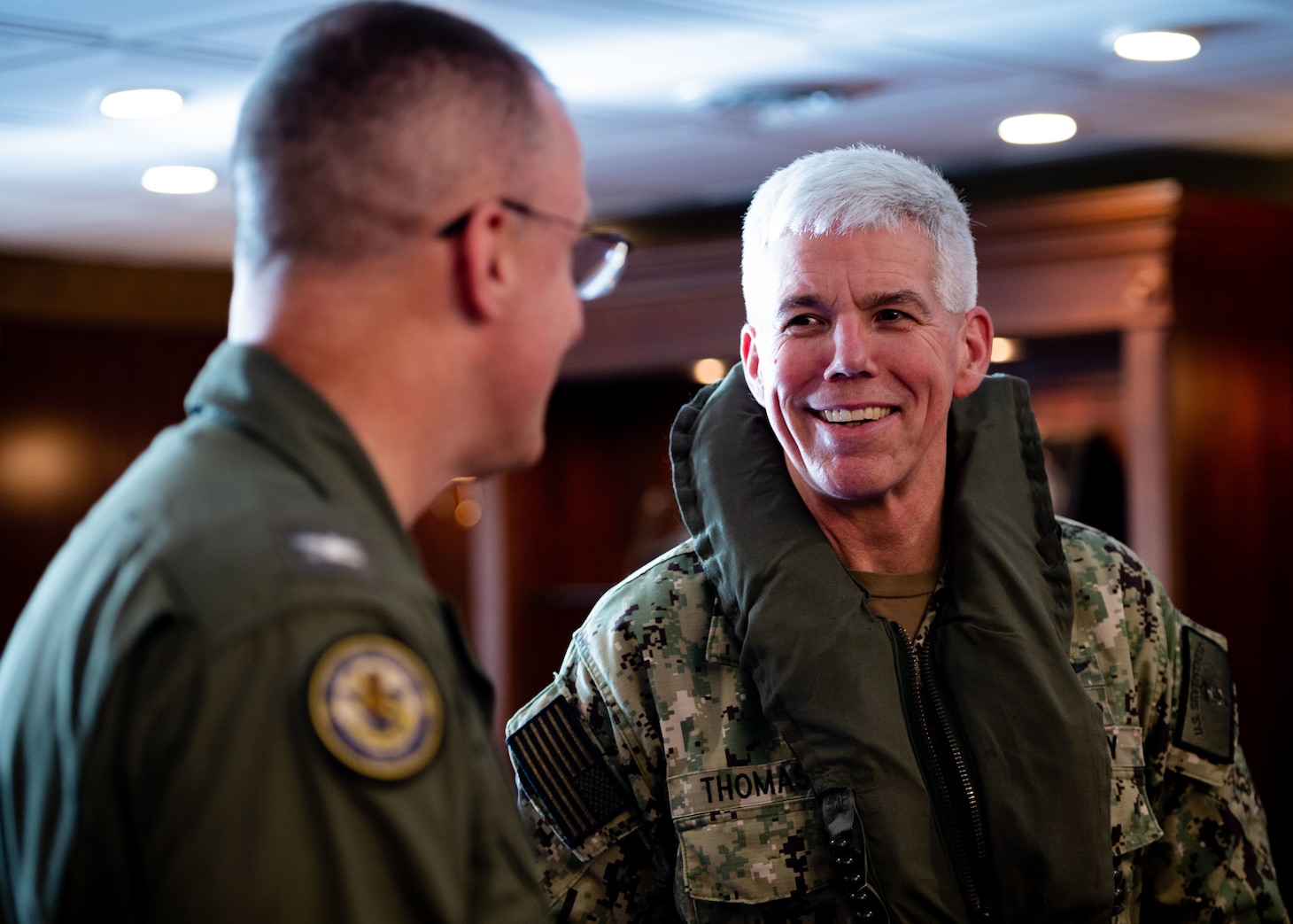 211130-N-SS900-1214 PHILIPPINE SEA (Nov. 30, 2021) Vice Adm. Karl Thomas, right, commander, U.S. 7th Fleet, talks to Capt. P. Scott Miller, commanding officer of Nimitz-class aircraft carrier USS Carl Vinson (CVN 70), in the commanding officer’s in port cabin aboard the ship during Annual Exercise (ANNUALEX) 2021, Nov. 30, 2021. ANNUALEX 2021 is a multilateral exercise conducted by naval elements of the Royal Australian, Royal Canadian, German, JMSDF and U.S. navies to demonstrate naval interoperability and a joint commitment to a free, open and inclusive Indo-Pacific. (U.S. Navy photo by Mass Communication Specialist 2nd Class Aaron T. Smith)