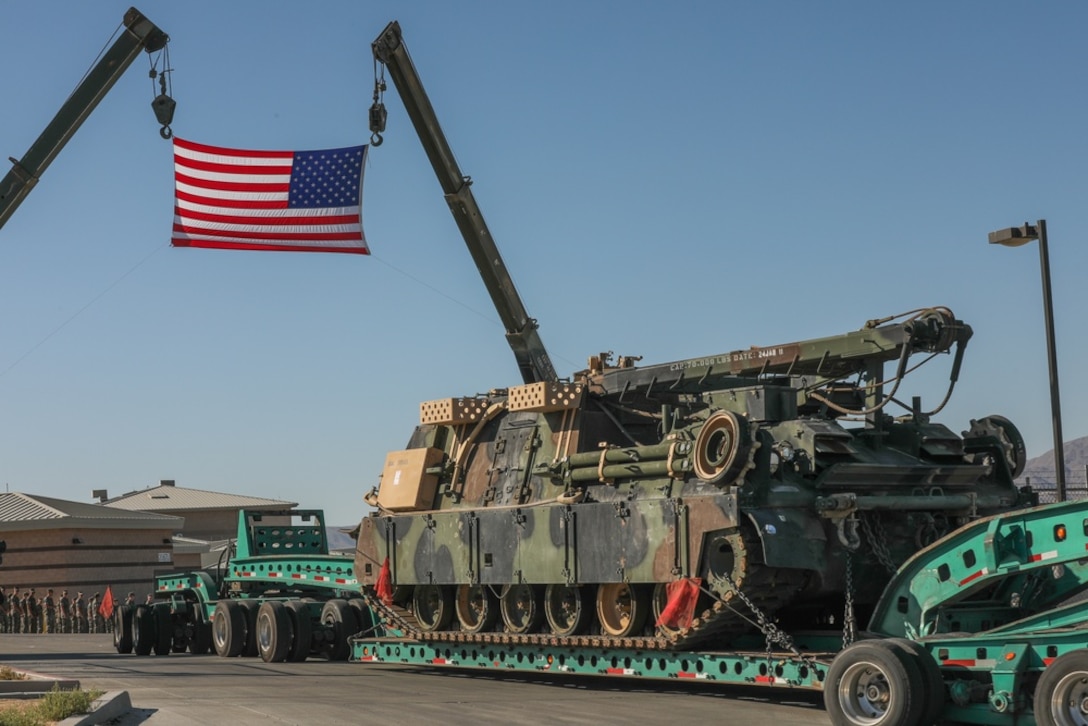 A U.S. Marine Corps Hercules M88 recovery vehicle disembarks from the 1st Tank Battalion ramp on a tow for the last time at Twentynine Palms, Calif. on July 28, 2020. As a part of Force Design 2030, the Hercules M88 recovery vehicles are being divested from the Marine Corps in an effort to accelerate modernization and realign capabilities, units and personnel to higher priority areas.
