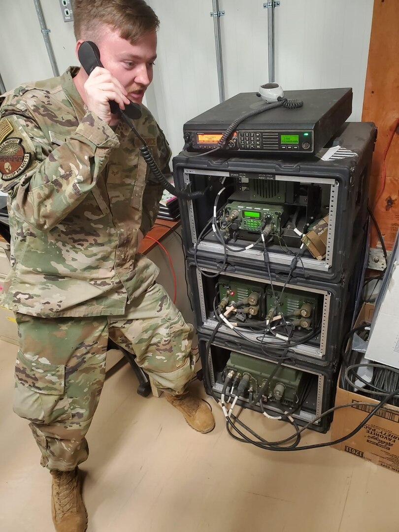 Senior Airman Jesse Lee, 776th Expeditionary Air Base Squadron radio and satellite communications technician, talks to another player in Latvia using high frequency (HF) radio calls during Noble Skywave Global HF competition at Chabelley Airfield, Djibouti, Oct. 27, 2021. Noble Skywave is an annual competition hosted by the Canadian Armed Forces to test and strengthen expertise in HF radio communications.