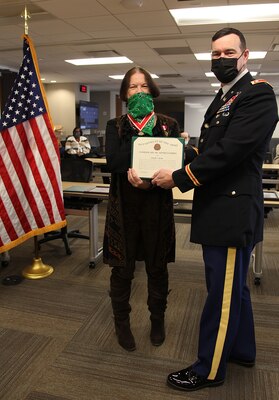 Leslie Bush receives an award during her retirement ceremony, 11-20-21.