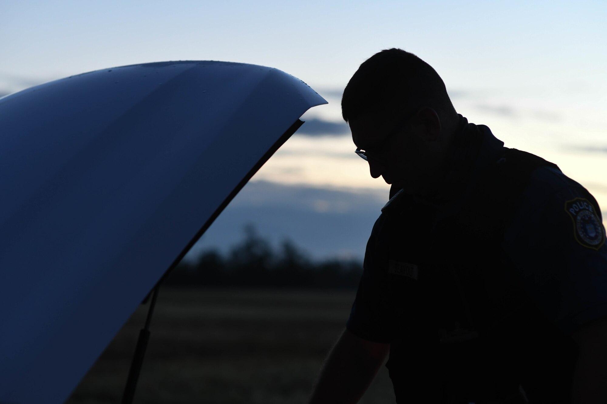 Archer Seavolt, 325th Security Forces Squadron patrolman, pops the hood of his patrol car during a routine vehicle inspection on his patrol car at Tyndall Air Force Base, Florida, Oct. 25, 2021.