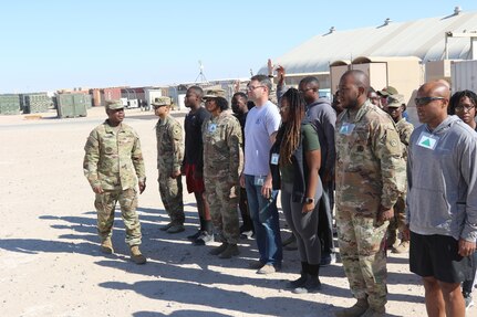 Sgt. 1st Class Keith Frazier "smokes" students in Equal Opportunity Leader course at Camp Buehring, Kuwait. The students were participating in the StarPower game in which they experience what it is like to be discriminated against.