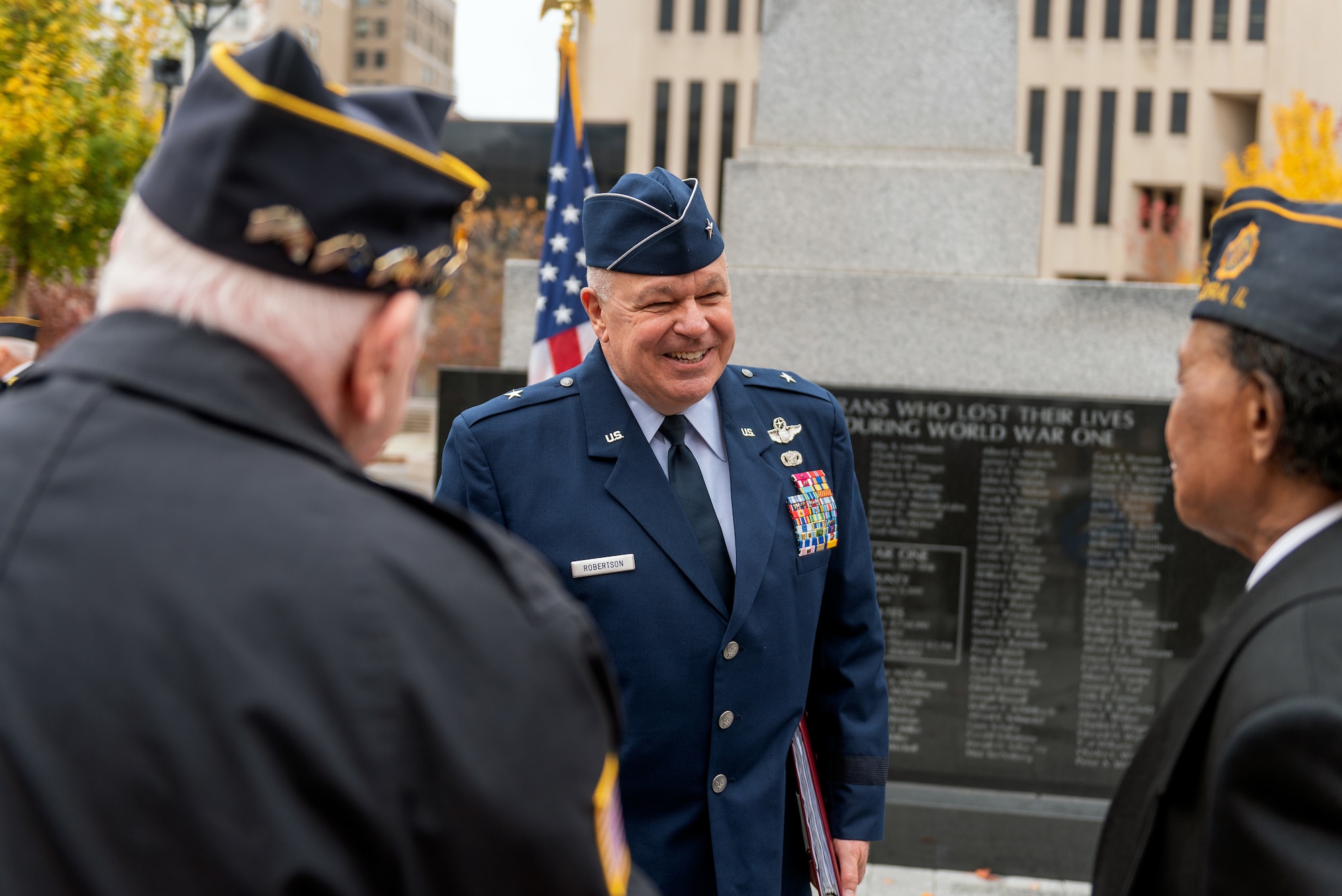 Airman visiting with crowd.