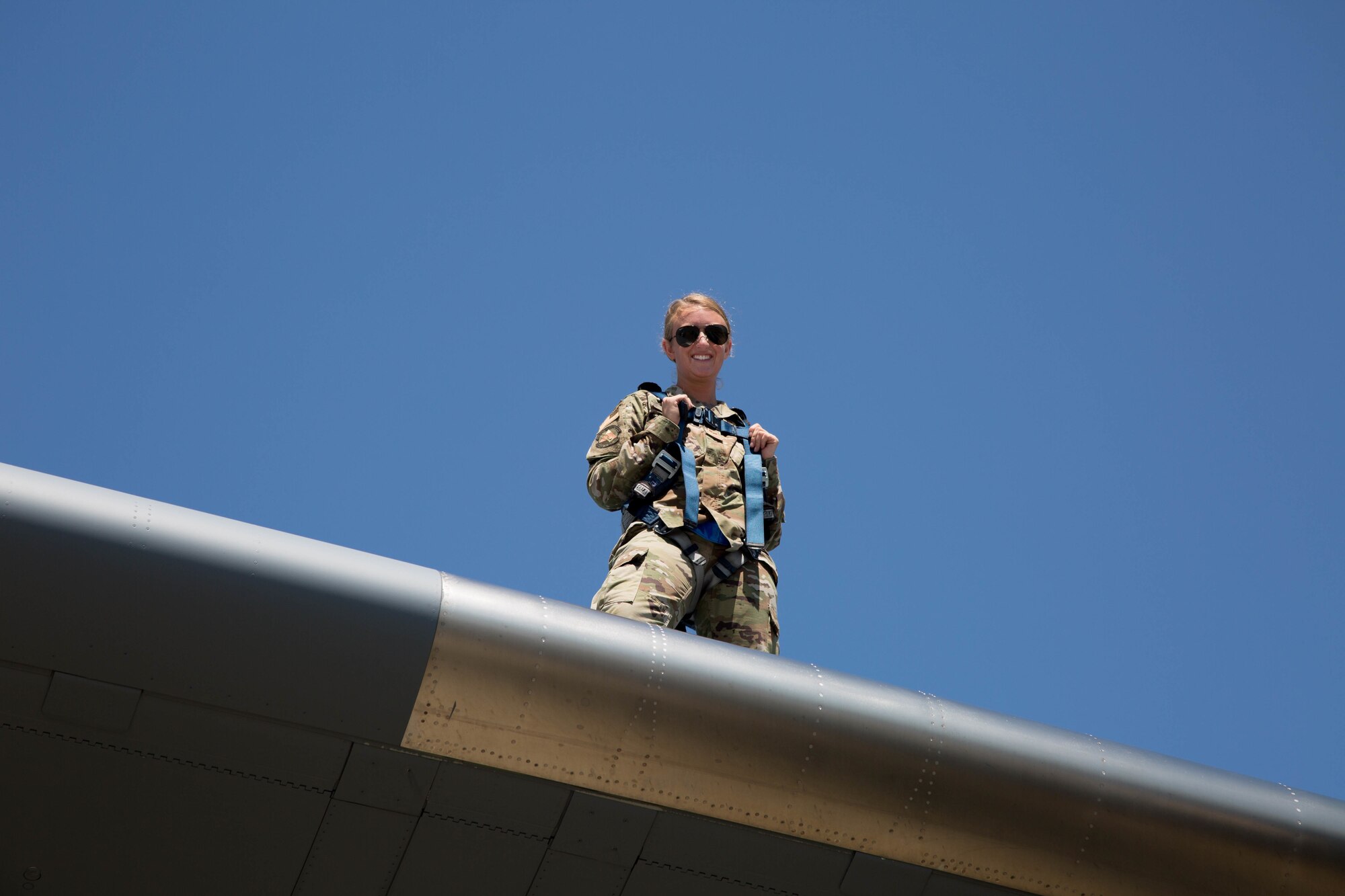 Staff Sgt. Shelby Pick, 446th Aircraft Maintenance Squadron crew chief, on top of a C-17 wing at Joint Base Lewis-McChord, Washington.