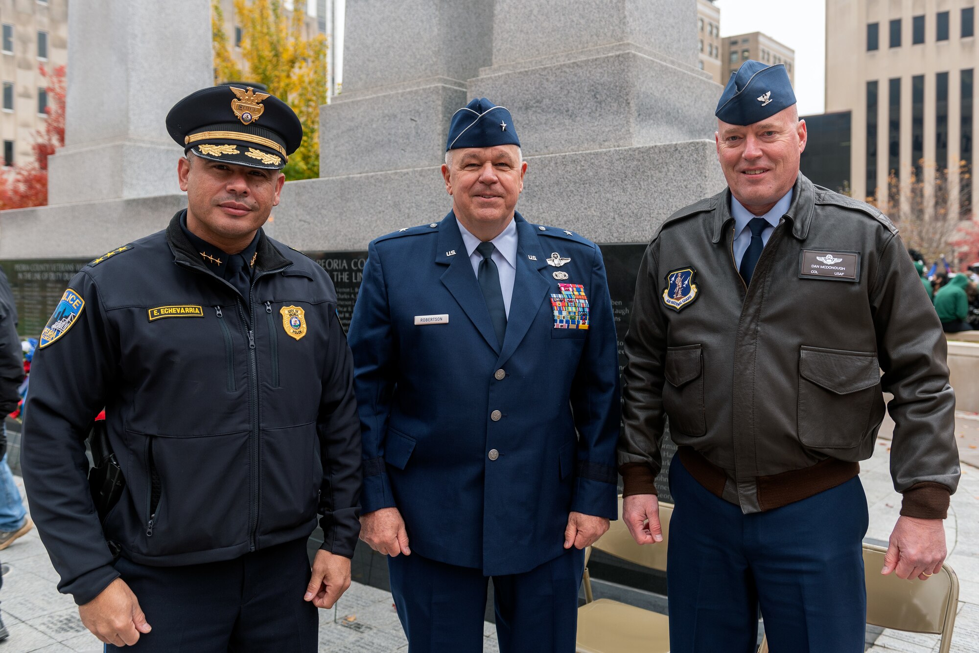 Men posing for photo.