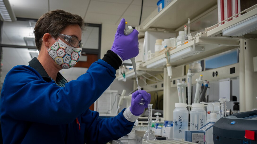 Domonkos Feher, PHNSY & IMF Chemist, conducts an analysis of the drinking water samples from a submarine. The analysis ensures the chlorine concentration is high enough, initially, to disinfect and that it returns to safe drinking water levels before the submarine’s potable water system is certified for drinking water use.