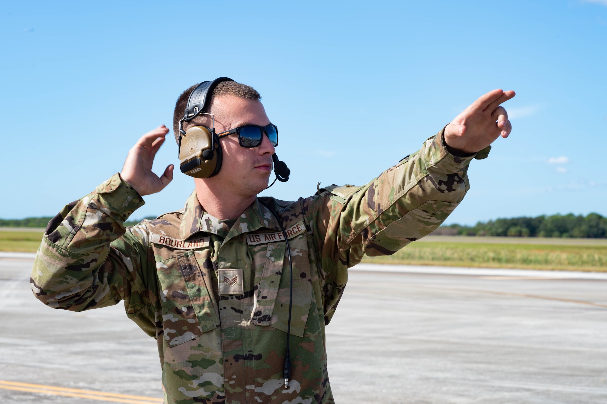 A photo of an Airman marshalling.