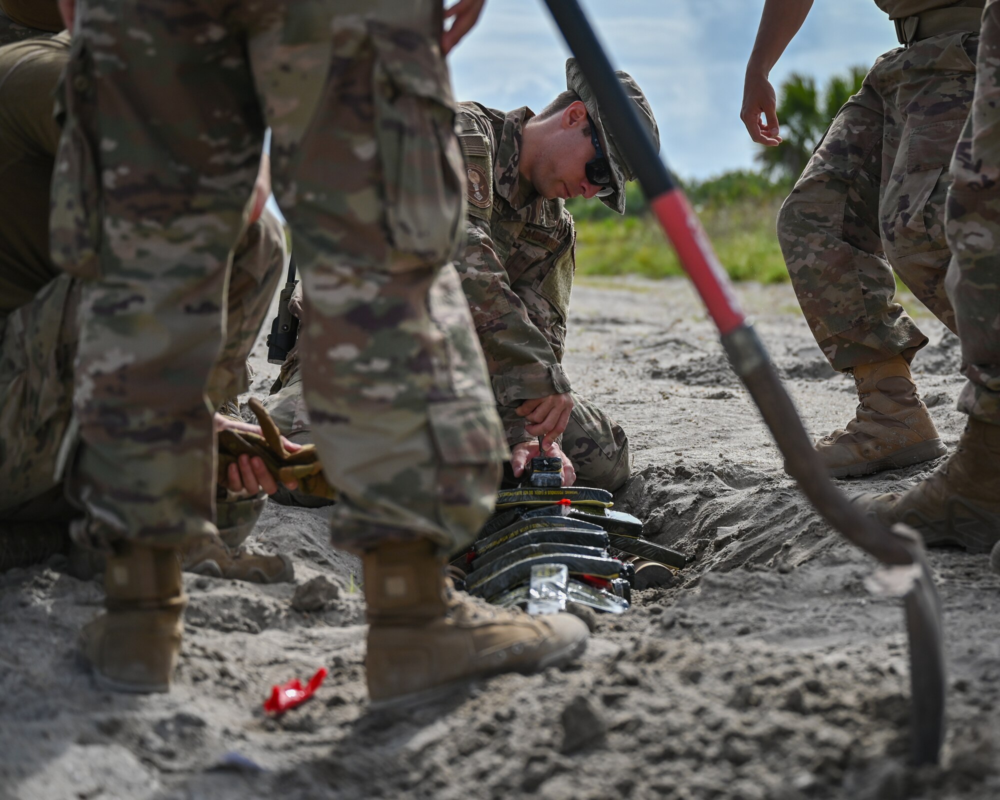 The 45th Civil Engineer Squadron Explosive Ordnance Disposal team prepares for live ordnance disposal of NASA rocket motors at Cape Canaveral Space Force Station, Fla., May 19, 2021. The 45th CES EOD team disposed of the rocket motors to minimize possible environmental impacts, increase knowledge and expertise for EOD Airmen, and keep the surrounding community safe. The team responded to calls to remove explosive devices from Palm Bay and Satellite Beach, Fla., around Thanksgiving. (U.S. Space Force photo by Airman First Class Thomas Sjoberg)