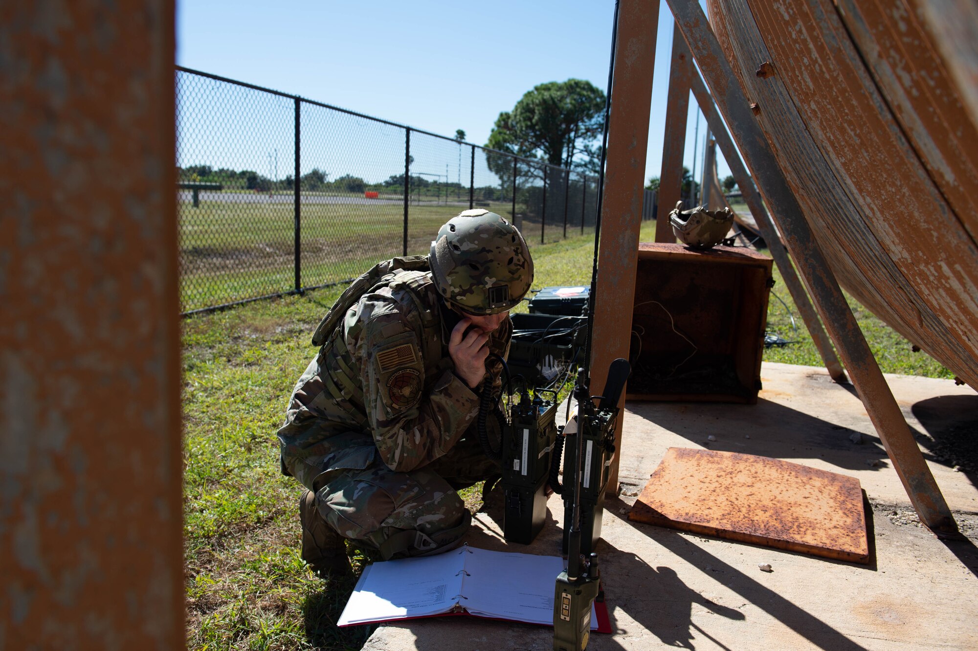 A photo of an Airman on a telephone.