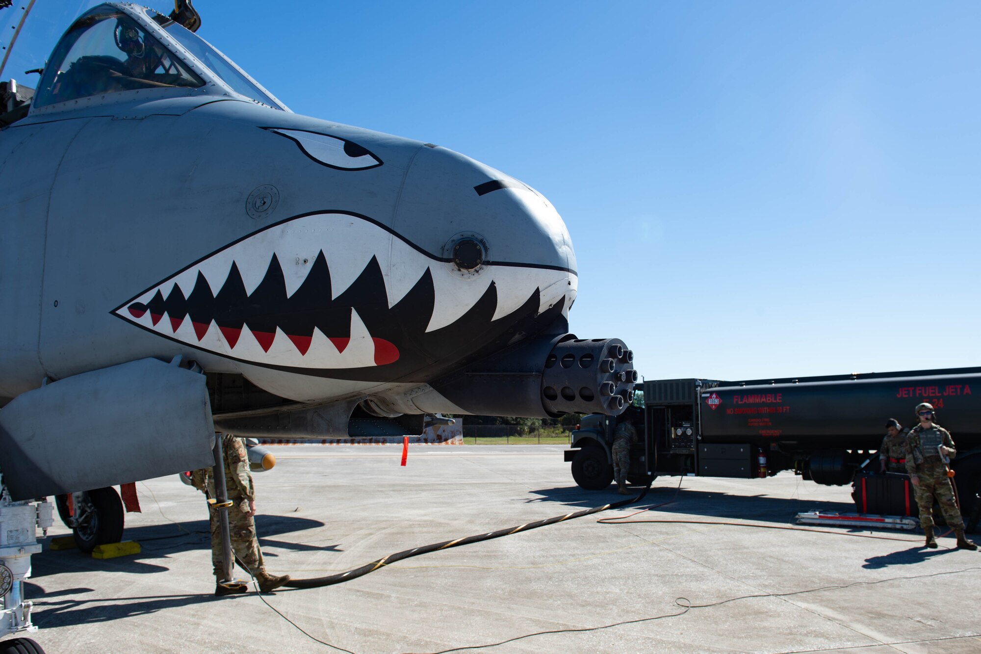 A photo of an aircraft and fuel truck.