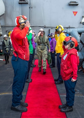 211130-N-IW069-1224 PHILIPPINE SEA (Nov. 30, 2021) Vice Adm. Karl Thomas, commander, U.S. 7th Fleet, is piped ashore of Nimitz-class aircraft carrier USS Carl Vinson (CVN 70), during Annual Exercise (ANNUALEX) 2021, Nov. 30, 2021. ANNUALEX 2021 is a multilateral exercise conducted by naval elements of the Royal Australian, Royal Canadian, German, Japan Maritime Self-Defense Force (JMSDF) and U.S. navies to demonstrate naval interoperability and a joint commitment to a free, open and inclusive Indo-Pacific. (U.S. Navy photo by Mass Communication Specialist 3rd Class Isaiah M. Williams)