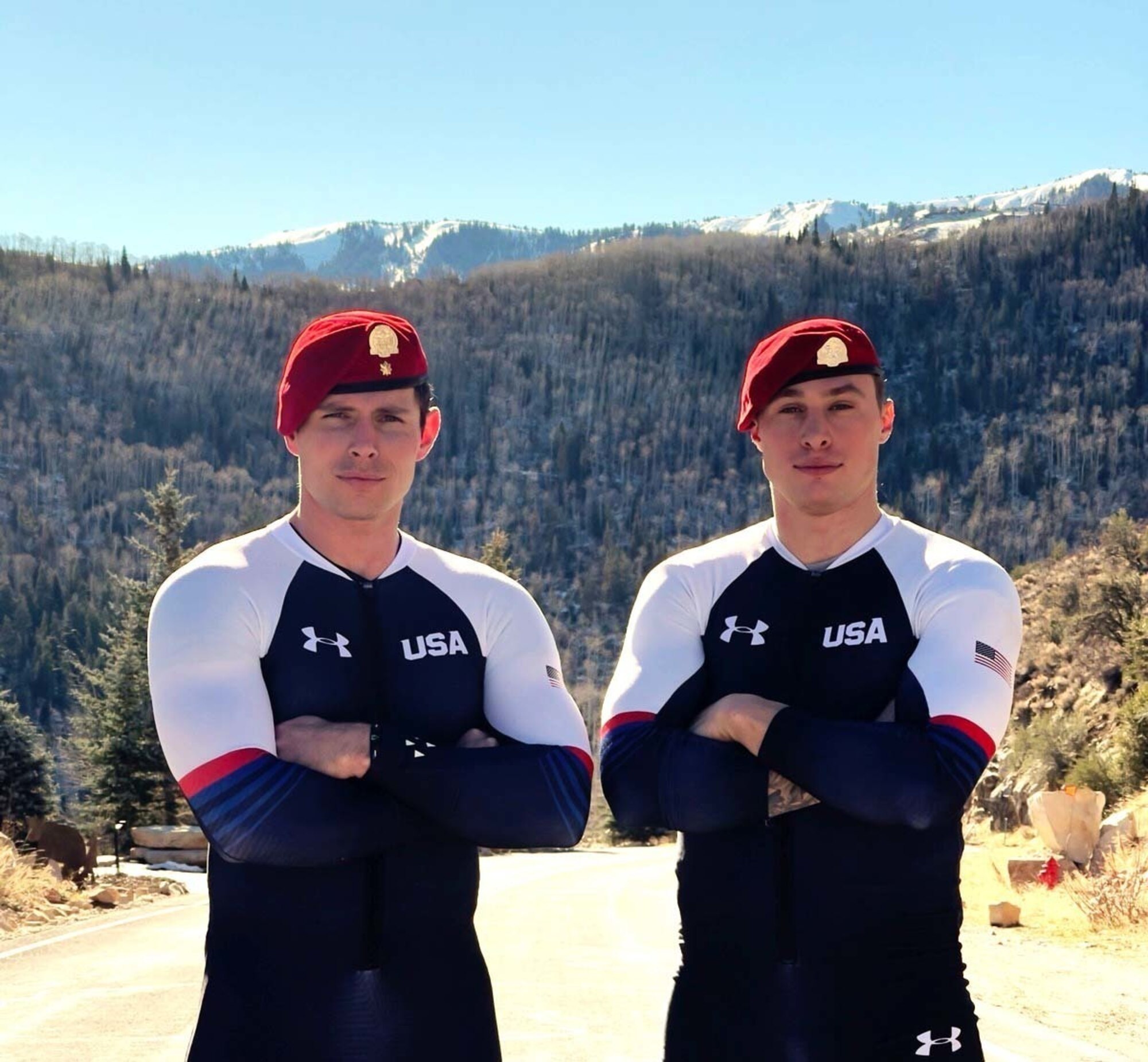 two athletes in a team usa dress pose for a portrait