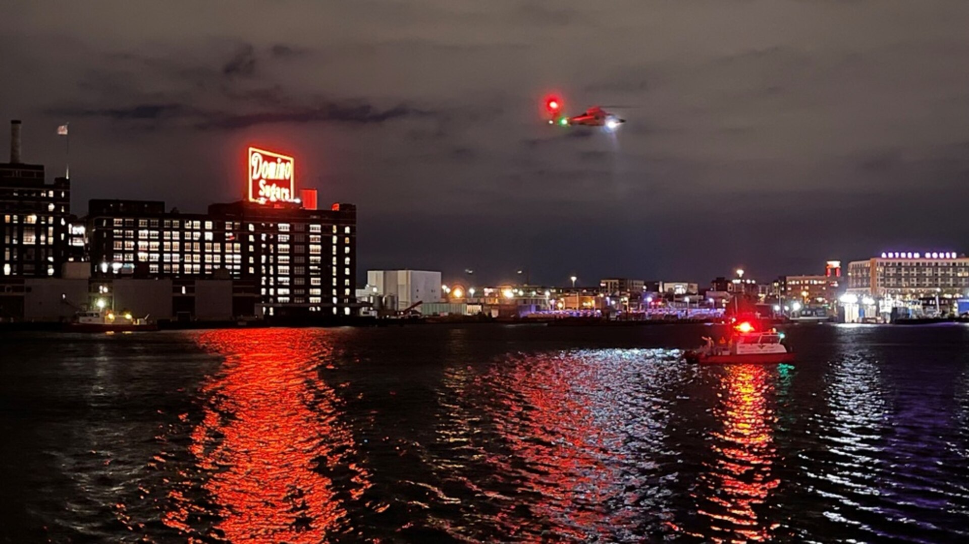 The Coast Guard and partner agencies are searching for a person in the water after he was last seen entering the water in the Inner Harbor of Baltimore. The Baltimore County Fire Department received the initial notification from the Canopy by Hilton Baltimore Harbor Point hotel security that they witnessed the person enter the water. (U.S. Coast Guard curtesy photo/Released)