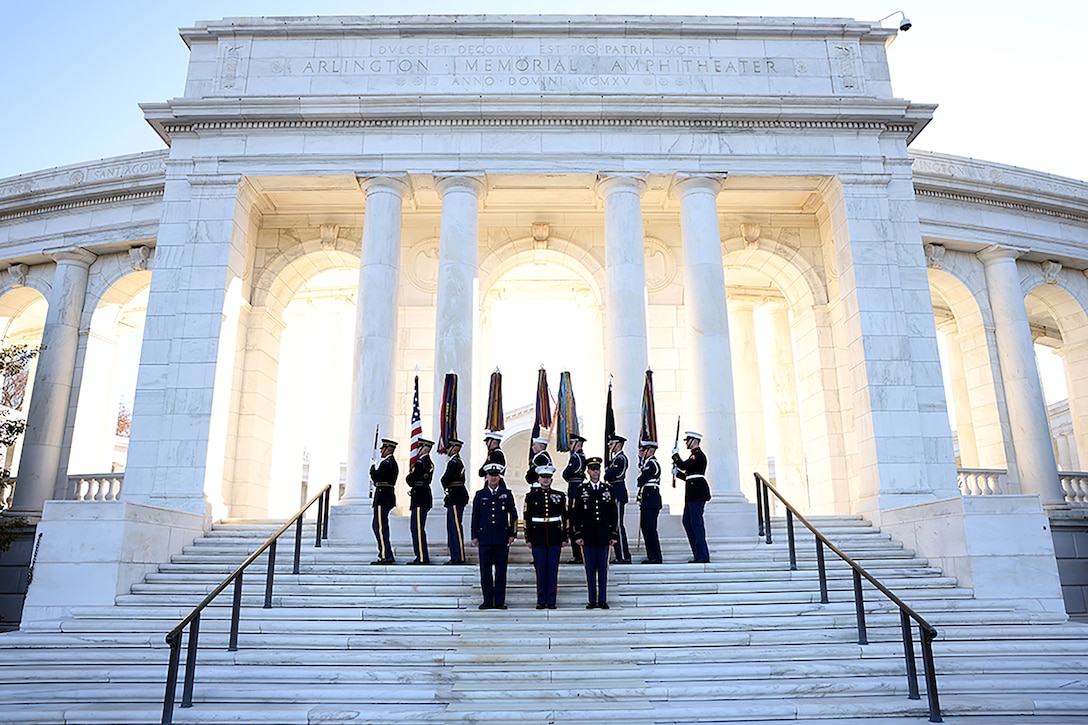 Joint service members stand in formation at the Tomb of the Unknown Soldier.