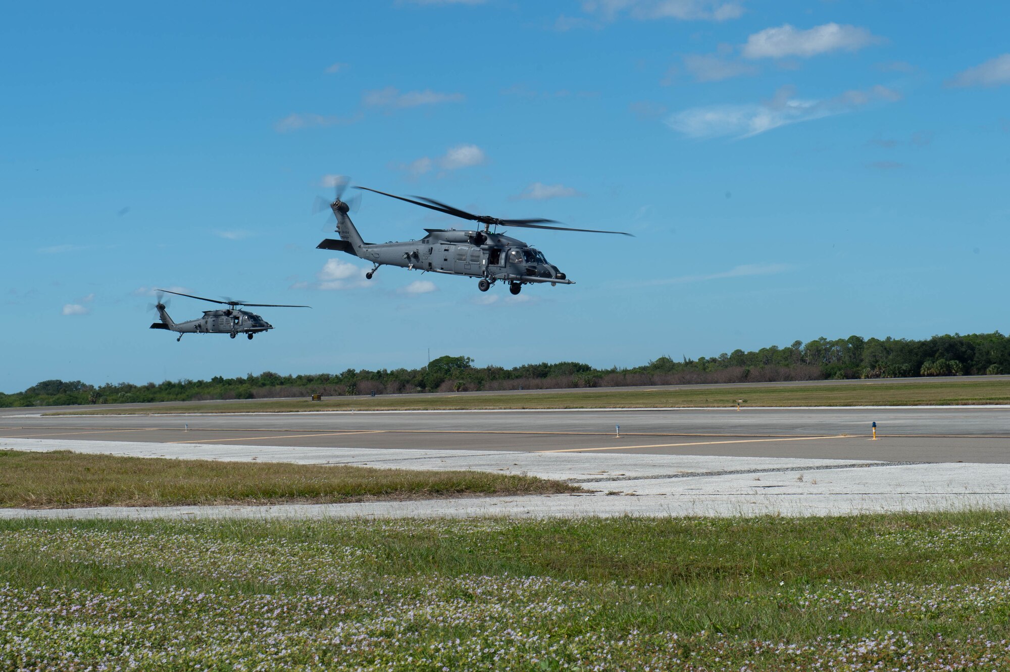 A photo of helicopters flying.