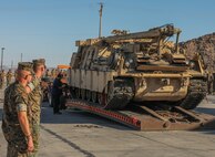 U.S. Marines with 1st Tank Battalion watches as one of the last Hercules M88 recovery vehicles are loaded up on a tow truck at Twentynine Palms, Calif. on July 28, 2020. As a part of Force Design 2030, the Hercules M88 recovery vehicles are being divested from the Marine Corps in an effort to accelerate modernization and realign capabilities, units and personnel to higher priority areas.