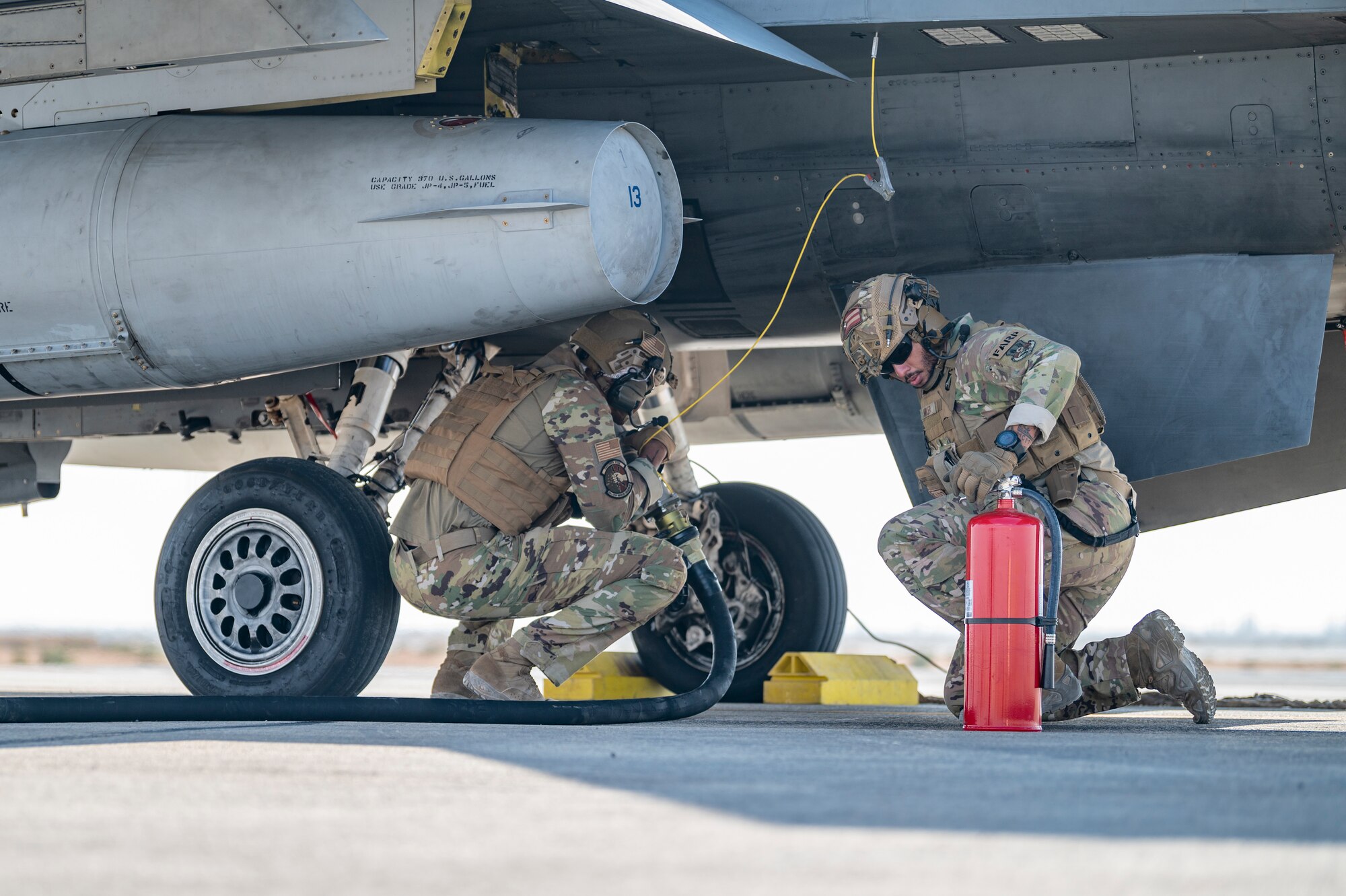 U.S. Airmen from the26th Expeditionary Rescue Squadron participate in a Forward Area Refueling Point (FARP) with an F-16C Fighting Falcons Nov. 26, 2021, at an undisclosed location somewhere in Southwest Asia.