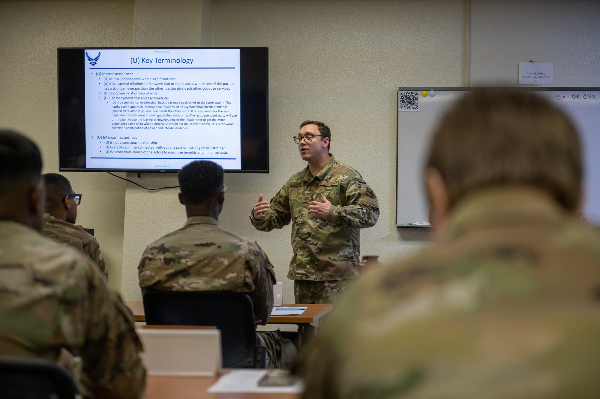 TSgt. Begeman briefing an international relations course.