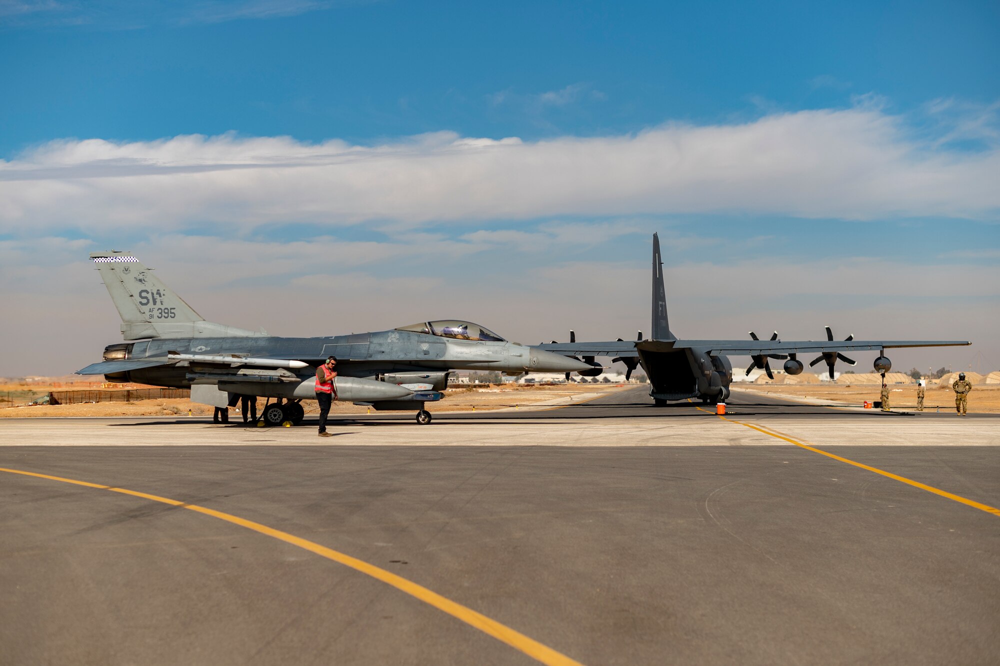 U.S. Airmen from the 26th Expeditionary Rescue Squadron set up a Forward Area Refueling Point (FARP) for two F-16C Fighting Falcons Nov. 26, 2021, at an undisclosed location somewhere in Southwest Asia.