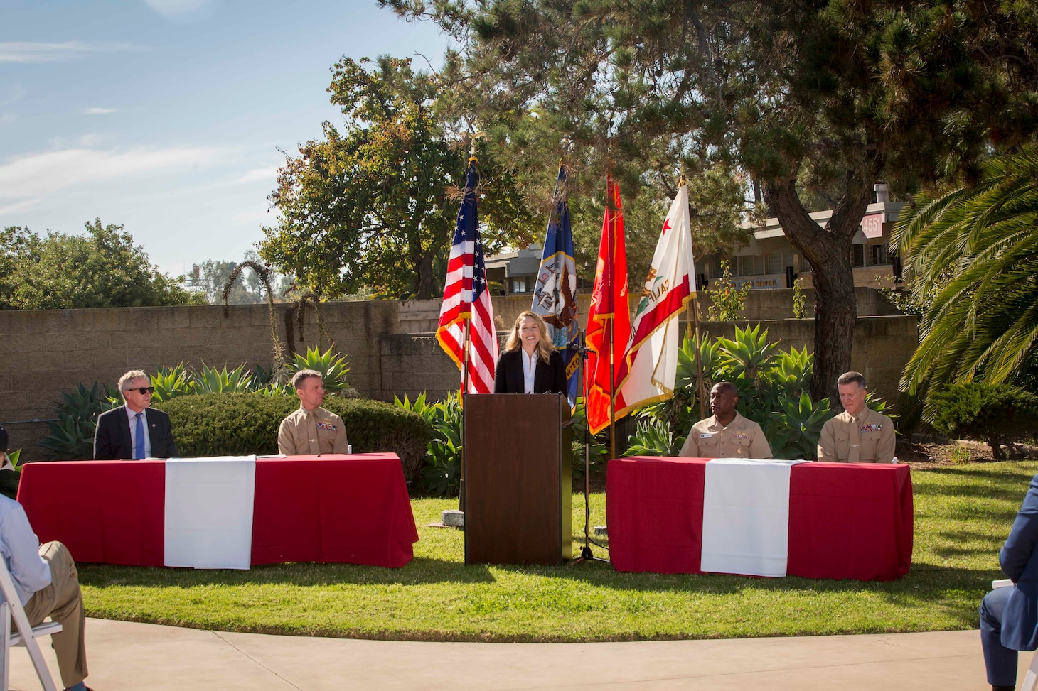 The Honorable Meredith Berger, performing the duties of the Under Secretary of the Navy,  speaks to a gathering of Marines, Sailors and local government officials of California before signing a Memorandum of Understanding with the California Energy Commission at Marine Corps Air Station Miramar, San Diego, California, Dec. 1, 2021.