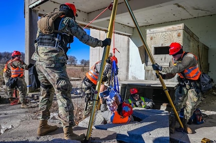 Nebraska National Guard Soldiers and Airmen set up equipment, donning protective suits and erecting tents for the Nebraska National Guard Chemical Biological Radiological Nuclear Enhanced Response Force Package (CERFP) team.