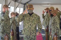 Capt. Milciades "Tony" Then, commodore, Destroyer Squadron (DESRON) 22, speaks during the DESRON 22 change of command ceremony on board the Arleigh Burke-class guided-missile destroyer USS Mitscher (DDG 57). DESRON 22 consists of guided-missile destroyers, including Mitscher, USS Laboon (DDG 58), USS Ramage (DDG 61), and USS Mahan (DDG 72). Established in March 1943, DESRON 22 is one of the oldest destroyer squadrons in the U.S. Navy. (U.S. Navy photo by Mass Communication Specialist 1st Class Jacob Milham/Released)