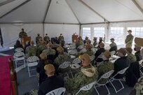 Capt. Milciades "Tony" Then, commodore, Destroyer Squadron (DESRON) 22, speaks during the DESRON 22 change of command ceremony on board the Arleigh Burke-class guided-missile destroyer USS Mitscher (DDG 57). DESRON 22 consists of guided-missile destroyers, including Mitscher, USS Laboon (DDG 58), USS Ramage (DDG 61), and USS Mahan (DDG 72). Established in March 1943, DESRON 22 is one of the oldest destroyer squadrons in the U.S. Navy. (U.S. Navy photo by Mass Communication Specialist 1st Class Jacob Milham/Released)