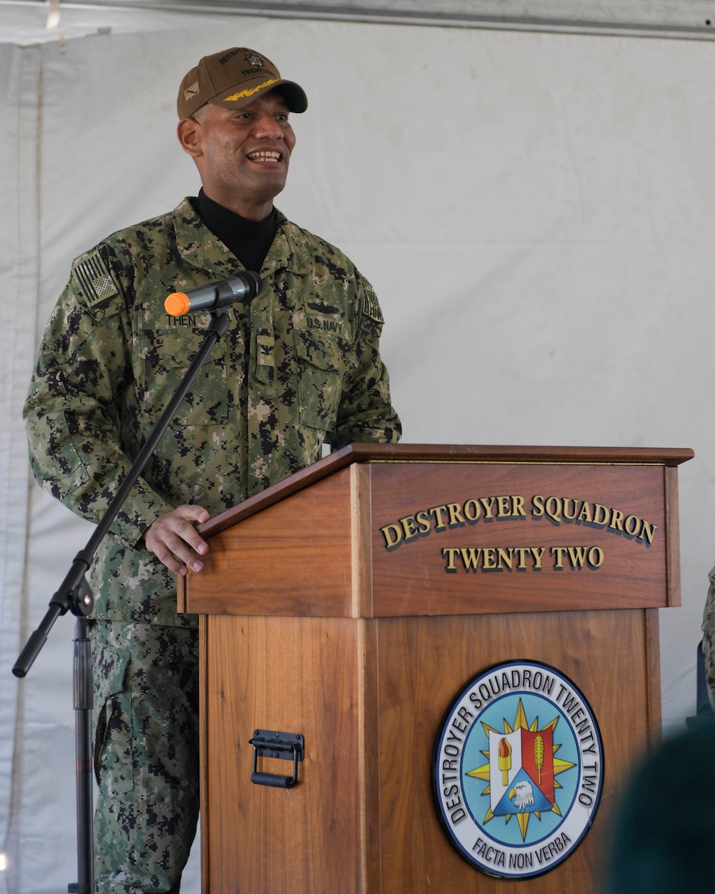 Capt. Milciades "Tony" Then, commodore, Destroyer Squadron (DESRON) 22, speaks during the DESRON 22 change of command ceremony on board the Arleigh Burke-class guided-missile destroyer USS Mitscher (DDG 57). DESRON 22 consists of guided-missile destroyers, including Mitscher, USS Laboon (DDG 58), USS Ramage (DDG 61), and USS Mahan (DDG 72). Established in March 1943, DESRON 22 is one of the oldest destroyer squadrons in the U.S. Navy. (U.S. Navy photo by Mass Communication Specialist 1st Class Jacob Milham/Released)