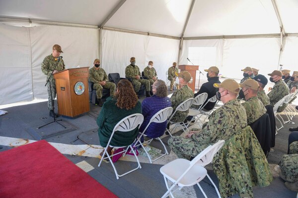 Capt. Scott Jones, the outgoing commodore, Destroyer Squadron (DESRON) 22, speaks at the DESRON 22 change of command ceremony on board the Arleigh Burke-class guided-missile destroyer USS Mitscher (DDG 57). DESRON 22 consists of guided-missile destroyers, including Mitscher, USS Laboon (DDG 58), USS Ramage (DDG 61), and USS Mahan (DDG 72). Established in March 1943, DESRON 22 is one of the oldest destroyer squadrons in the U.S. Navy. (U.S. Navy photo by Mass Communication Specialist 1st Class Jacob Milham/Released)