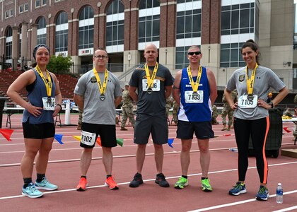 The 2021 New Hampshire National Guard Marathon Team poses at University of Nebraska's Ed Weir Stadium following their May 2 Lincoln Marathon finish.