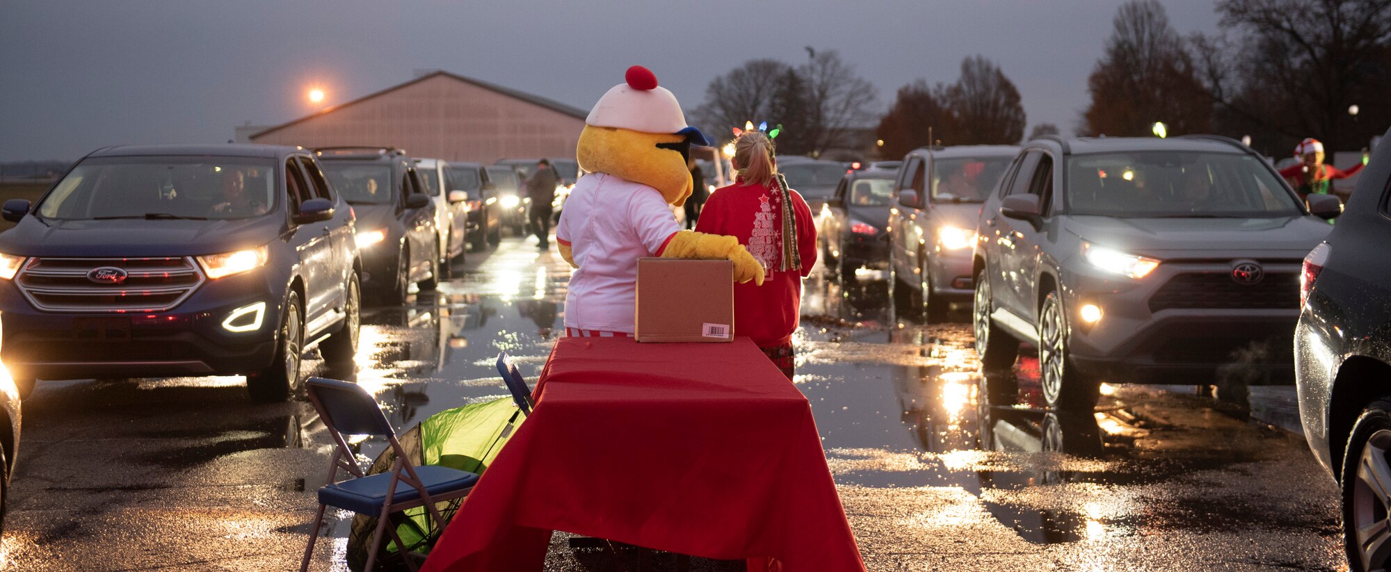 211201-F-WD117-2011
Cars line up for the 2021 Tree Lighting drive-thru event hosted by the 88th Force Support Squadron at Wright-Patterson Air Force Base, Ohio, Dec. 1, 2021. Families were able to go through the drive-thru, get goody bags and hot chocolate from Santa’s elves, and then park to watch the lighting of the base’s Christmas tree over Facebook Live. (U.S. Air Force photo by Jaima Fogg)