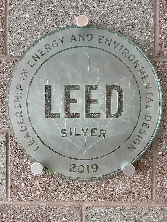 The U.S. Green Building Council’s Leadership in Energy and Environmental Design plaque is displayed in the entryway of the F-35 Flight Simulator Center on Eielson Air Force Base.
