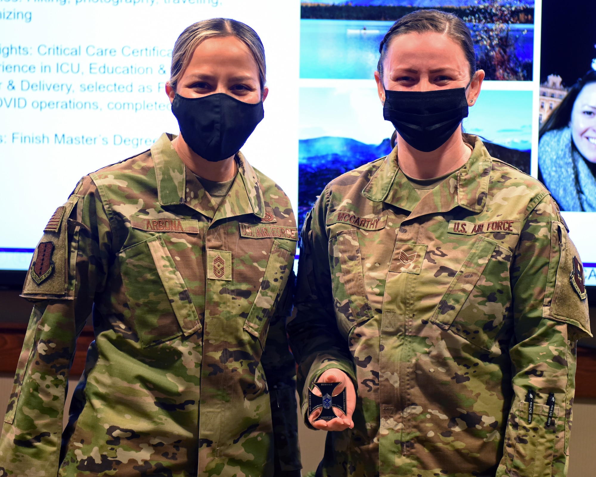 U.S. Air Force Chief Master Sgt. Rebecca Arbona, 17th Training Wing command chief, and Staff Sgt. Megan McCarthy, 17th Healthcare Operations Squadron section chief of women’s health and pediatrics, pose for a photo on Goodfellow Air Force Base, Texas, Nov. 30, 2021. McCarthy was coined for her hard work and outstanding performance in her career field as a section chief.