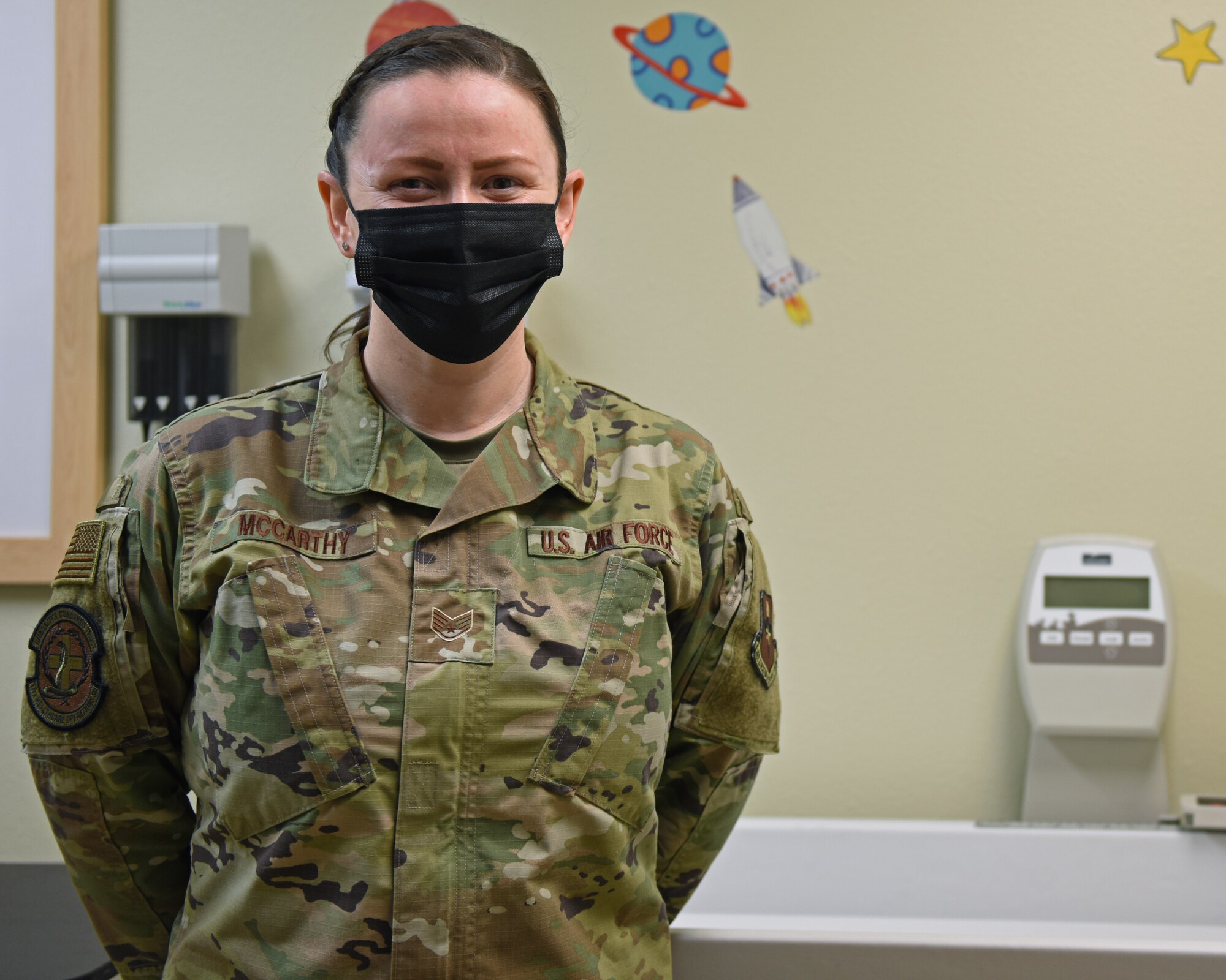 U.S. Air Force Staff Sgt. Megan McCarthy, 17th Healthcare Operations Squadron section chief of women’s health and pediatrics, poses for a portrait in a pediatric exam room on Goodfellow Air Force Base, Texas, Nov. 30, 2021. McCarthy ensures that the women’s health and pediatrics clinic has supplies, equipment, and the resources needed to care for patients.